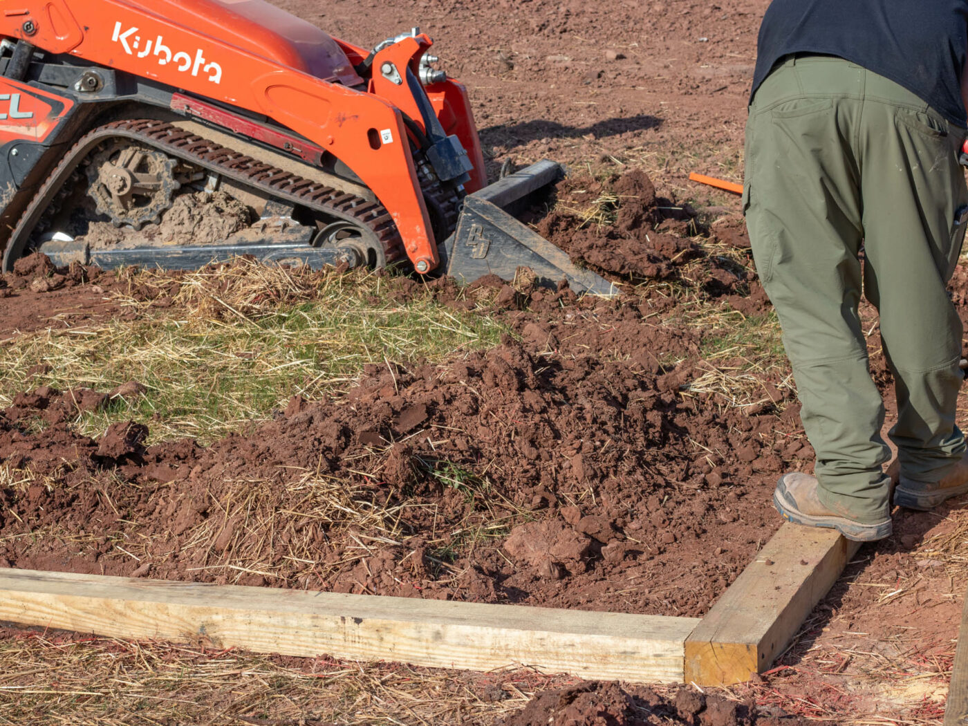 installing a gravel shed pad and using skid steer in the process
