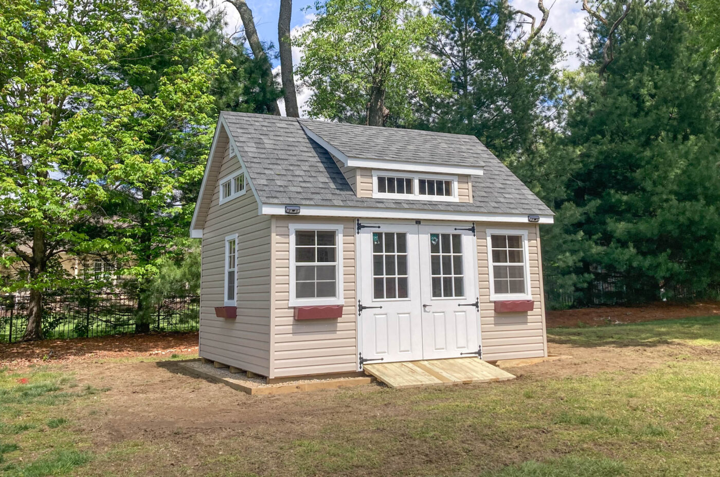 a completed gravel shed pad with a new shed installed on it