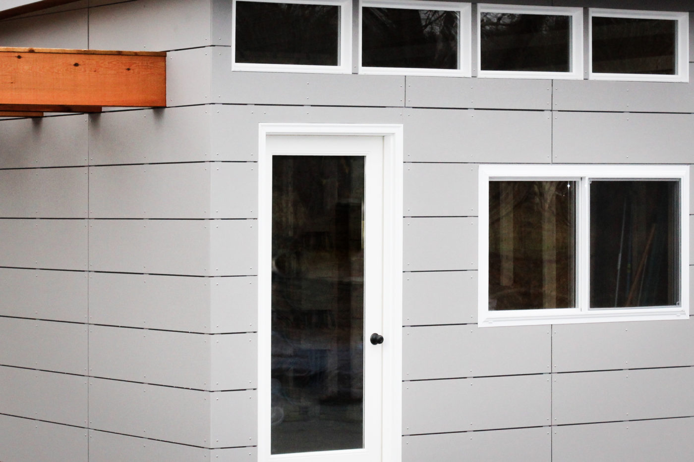 A shed with modern siding