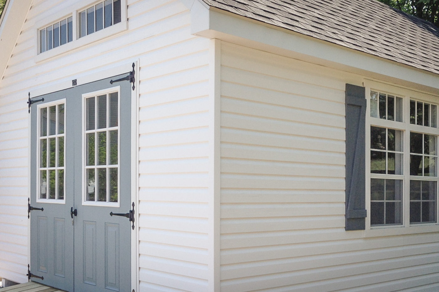 A shed with vinyl siding
